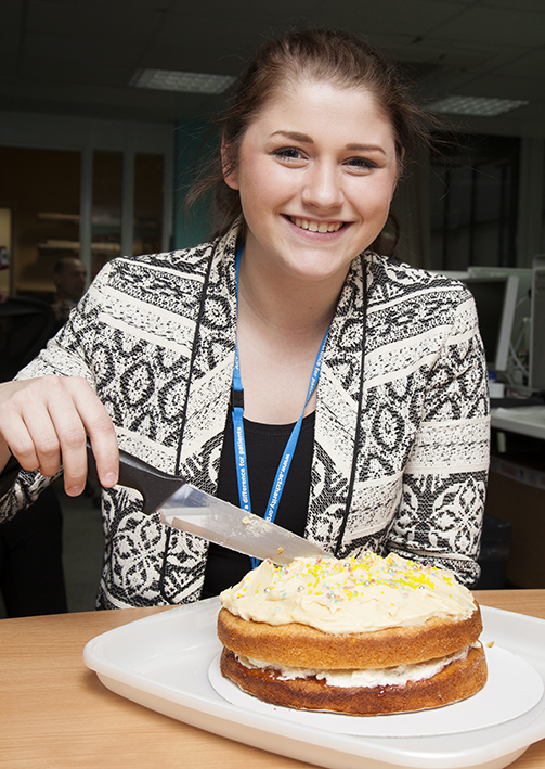 Emily cutting a cake