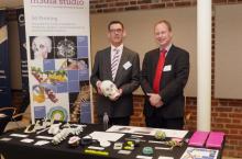 Jerry Nayler and James Hallinan with the Media Studio 3d Printing exhibition stand with anatomical, engineering and biochemical structural models